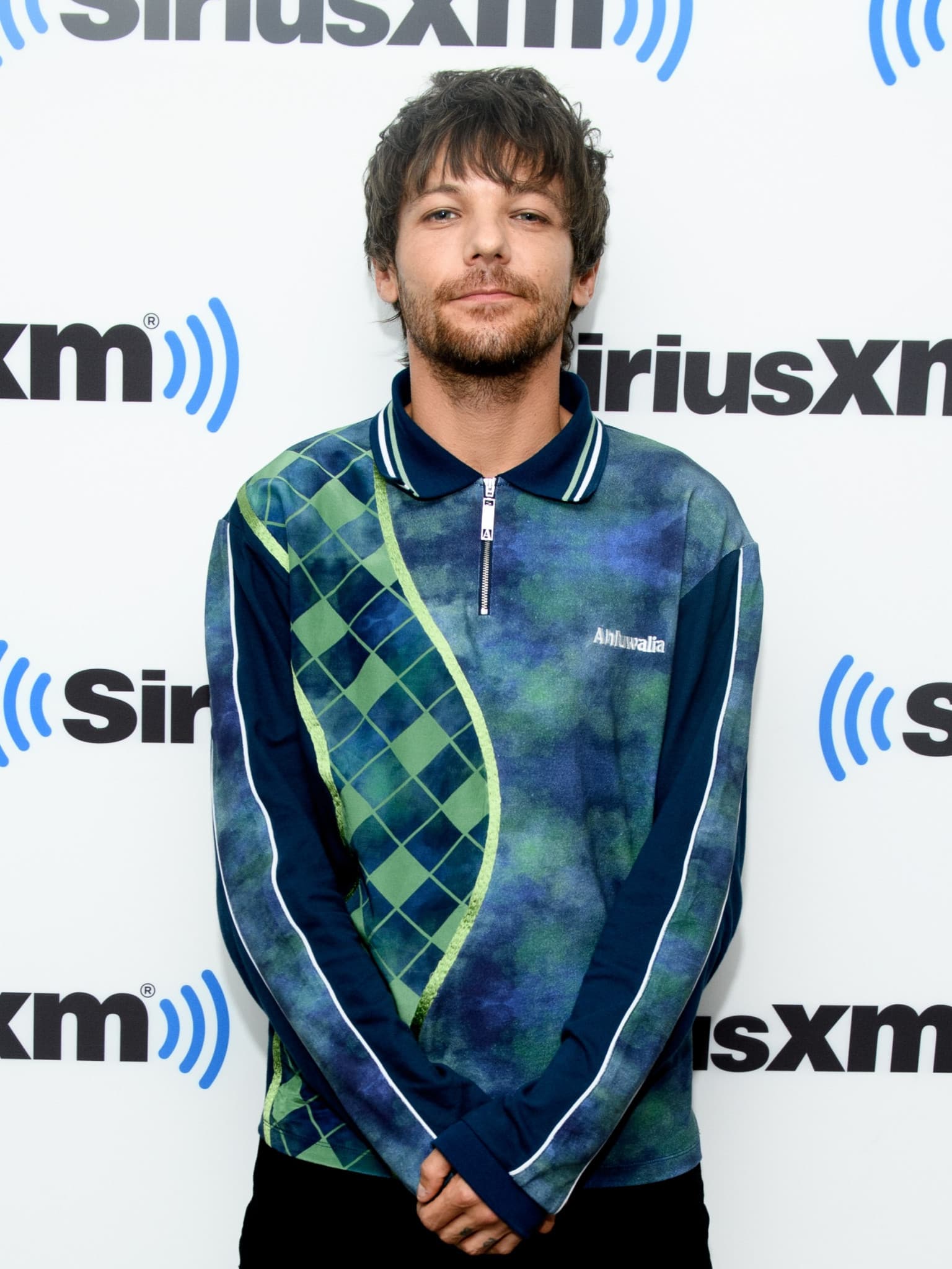 Louis Tomlinson hat sich lange Zeit mit seinen One Direction-Kollegen verglichen